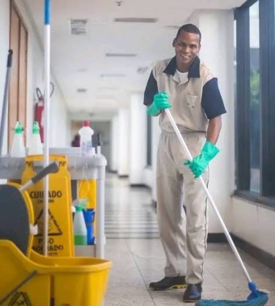 Cleaner maintaining an office building corridor